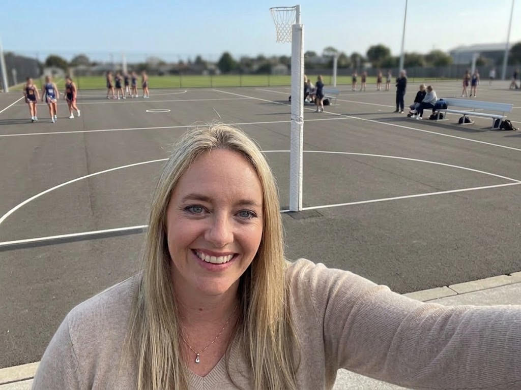 Candice Dougall, Squaddie's founder, courtside at a netball club in Tasman