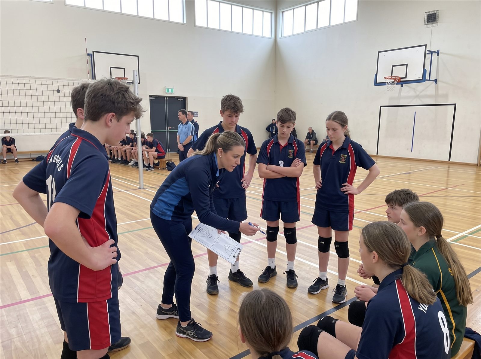 Volleyball team coaching in action